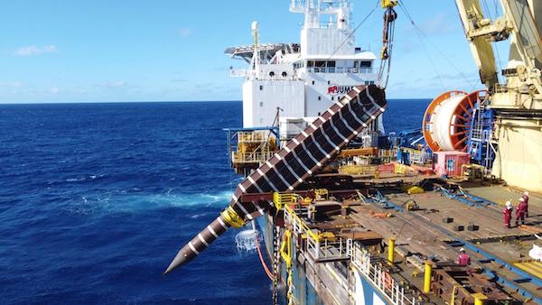 Jumbo Fairplayer overboarding torpedo pile for FPSO mooring system