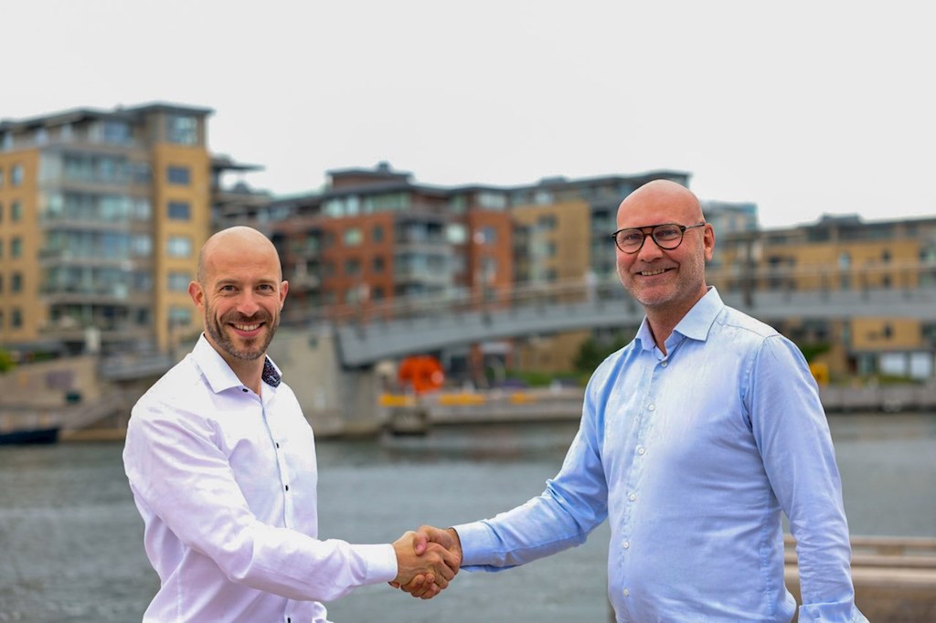 Main illustration Peter Morsbach CEO Hoglund and Rune Braastad President ABBs Marine and Ports division shaking hands Image credit ABB