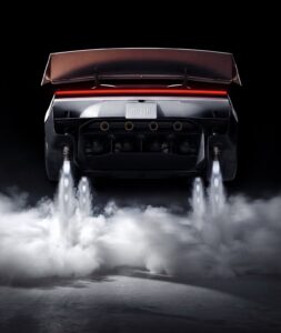 Rear view of the Tesla Roadster with thrusters operating in a Tesla promotional image